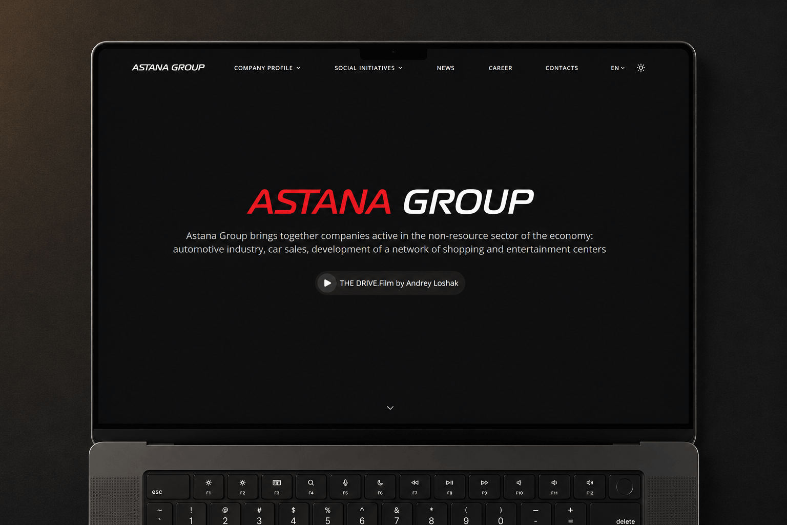 Astana Group website, dark corporate homepage with the group's brand mark